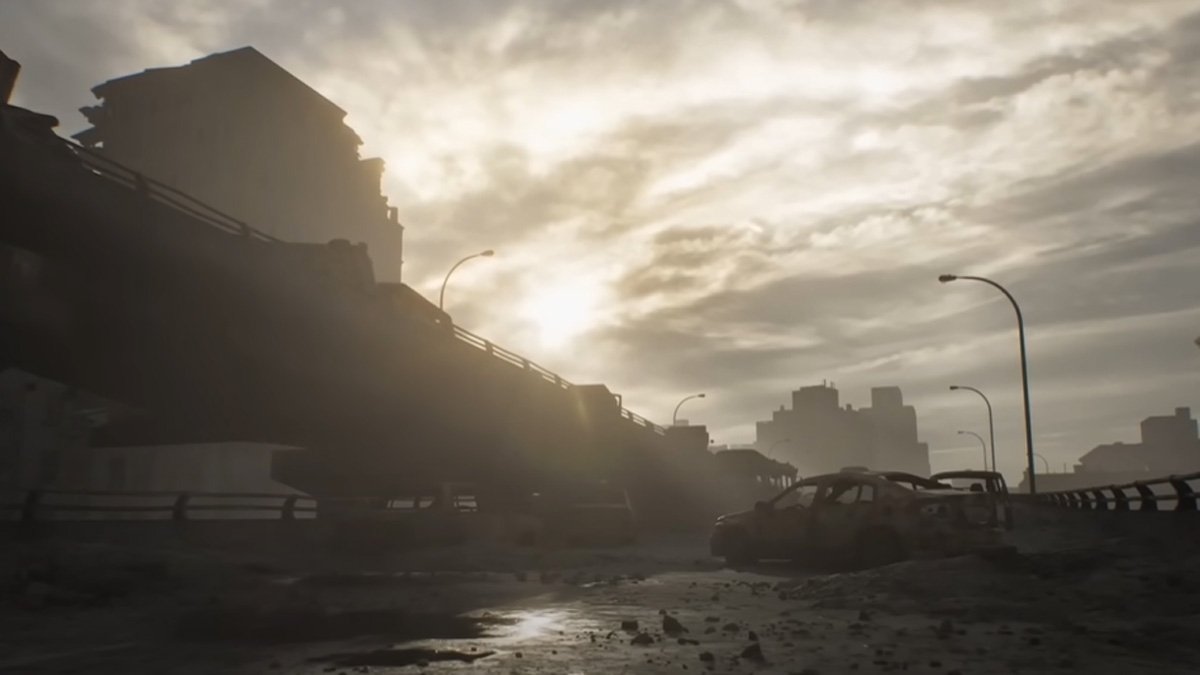 Desolate Raccoon City highway with destroyed buildings and wrecked cars under a cloudy, sunlit sky