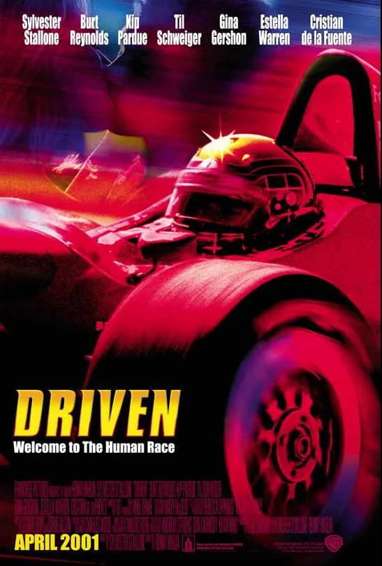 Scene from Driven (2001) showing open-wheel race cars in a dramatic on-track moment.